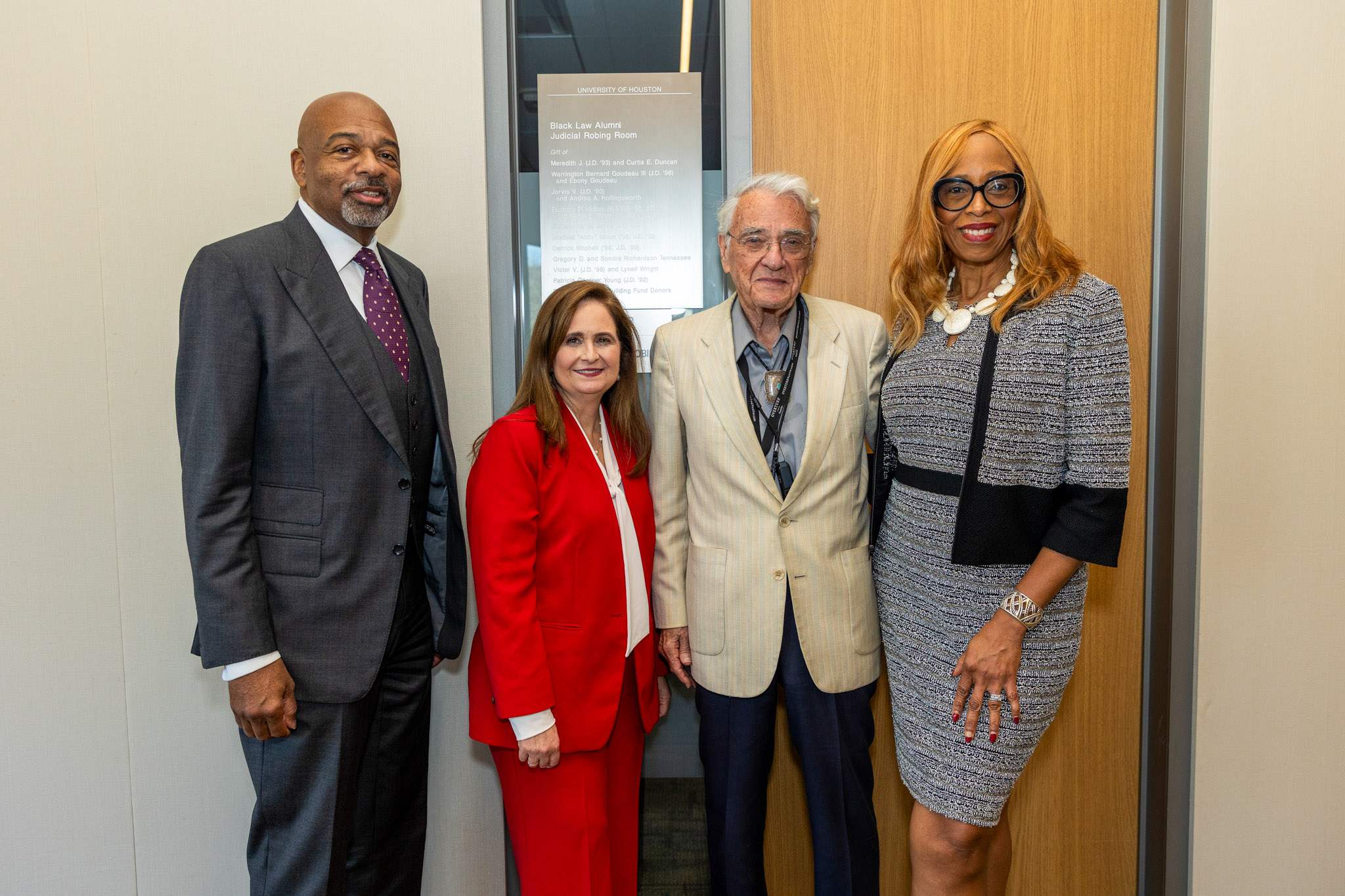 The three Fifth Circuit judges stand with UHLC Associate Dean Sondra Tennessee at the University of Houston Law Center.